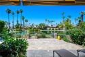 Welcome to The Lakes Country Club! This South-facing, waterfront for sale in Palm Desert California Riverside County County on GolfHomes.com