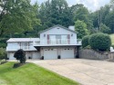 Welcome to 411 E. Mohawk Dr., Malvern. Nestled in the private for sale in Malvern Ohio Carroll County County on GolfHomes.com
