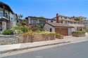 Welcome to your serene coastal retreat with a mid-century modern for sale in San Clemente California Orange County County on GolfHomes.com