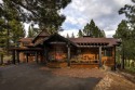 Beyond the fireplace, great room, dining room and back patio for sale in Truckee California Placer County County on GolfHomes.com