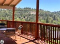 Experience privacy and stunning Sierra views on this 16-acre for sale in Groveland California Tuolumne County County on GolfHomes.com