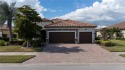 Stunning Pool Home with Lake and Preserve Views in Gran Paradiso
 for sale in Venice Florida Sarasota County County on GolfHomes.com