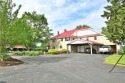 An opportunity like no other, this sprawling nine-hole Champion for sale in Warren Ohio Trumbull County County on GolfHomes.com