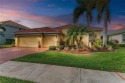 Stunning Stoneybrook Home with Lucas Lagoon Saltwater Pool for sale in Bradenton Florida Manatee County County on GolfHomes.com