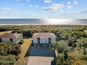 Uncover the ultimate beach getaway in this highly desirable for sale in Caswell Beach North Carolina Brunswick County County on GolfHomes.com