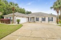 This immaculate pool home is on a quiet peaceful cul-de-sac just for sale in Pensacola Florida Escambia County County on GolfHomes.com