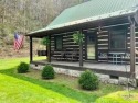 This picturesque hand-hewn log cabin has it all!  Located within for sale in White Sulphur Springs West Virginia Greenbrier County County on GolfHomes.com