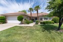 This charming home opens onto a community green with paved paths for sale in Saint George Utah Washington County County on GolfHomes.com