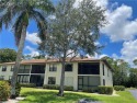 Located on a quiet street overlooking lush landscaping and the for sale in Naples Florida Collier County County on GolfHomes.com