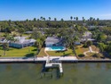 Seize the chance to own a prime 74-foot waterfront lot for sale in Dunedin Florida Pinellas County County on GolfHomes.com