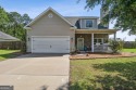 Imagine retreating to your spacious master suite on the main for sale in Ellabell Georgia Bryan County County on GolfHomes.com