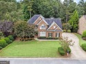 WONDERFUL 6BR/5BA HOME IN WOODMONT GOLF AND COUNTRY CLUB - FLAT for sale in Canton Georgia Cherokee County County on GolfHomes.com