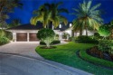 Welcome to your dream one-story lakefront pool home with over for sale in Naples Florida Collier County County on GolfHomes.com