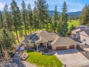 This home has a VA assumable loan at a low interest rate for sale in Post Falls Idaho Kootenai County County on GolfHomes.com