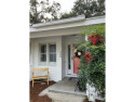 This adorable cottage has an updated kitchen, flooring, outdoor for sale in Saint Simons Georgia Glynn County County on GolfHomes.com