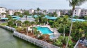 Walk to Deeded Beach!  Beautiful waterfront condo w/ glassed in for sale in Stuart Florida Martin County County on GolfHomes.com