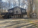 Come get peace of mind with this Tanglwood Lakes 4-bedroom for sale in Greentown Pennsylvania Pike County County on GolfHomes.com