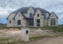The luxurious details and functional layout of this new for sale in Gunter Texas Grayson County County on GolfHomes.com