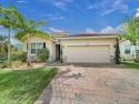 Experience effortless living as you arrive at this home nestled for sale in Jensen Beach Florida Martin County County on GolfHomes.com