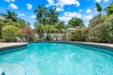 Investor's dream! This furnished 3BD/2BA coastal-style pool home for sale in Hollywood Florida Broward County County on GolfHomes.com