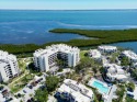 *No storm damage - Welcome to this upgraded and partially for sale in Longboat Key Florida Sarasota County County on GolfHomes.com
