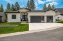 IMMACULATE MODERN RANCHER on the 14th Fairway of THE HIGHLANDS for sale in Post Falls Idaho Kootenai County County on GolfHomes.com