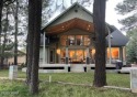 A beautiful, well maintained, custom built home sits front and for sale in Pinetop Arizona Navajo County County on GolfHomes.com