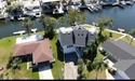 This Key West style Elevated home did not flood during hurricane for sale in New Port Richey Florida Pasco County County on GolfHomes.com