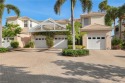 WOW - A THREE CAR GARAGE CONDO - Unheard of in this sought after for sale in Bonita Springs Florida Lee County County on GolfHomes.com