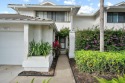 Enjoy beautiful water views from this two-story Foxcross condo for sale in Stuart Florida Martin County County on GolfHomes.com