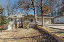 Featuring a workshop or bonus area, garage, and level driveway for sale in Hot Springs Village Arkansas Garland County County on GolfHomes.com