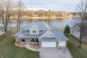 Nestled in Canadian Lakes with sweeping views of Lake Laura and for sale in Canadian Lakes Michigan Mecosta County County on GolfHomes.com
