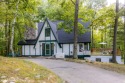 Welcome to this distinctive four-bedroom, three-bath chalet for sale in Stanwood Michigan Mecosta County County on GolfHomes.com
