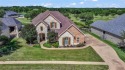 Step into this stunning custom-built home, perfectly positioned for sale in Weatherford Texas Parker County County on GolfHomes.com