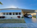 This charming 2-bedroom, 2-bath home offers 960 sq ft of living for sale in Largo Florida Pinellas County County on GolfHomes.com