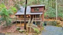 Nature abounds at this furnished cabin nestled on the banks of for sale in Ellijay Georgia Gilmer County County on GolfHomes.com