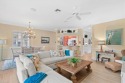 Welcome to this light and bright coach home offering a spacious for sale in Naples Florida Collier County County on GolfHomes.com