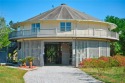 Welcome to your safe getaway on the Coast! Enjoy coastal living for sale in Pass Christian Mississippi Harrison County County on GolfHomes.com