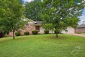 Conveniently located near the golf course, this brick home has for sale in Harrison Arkansas Boone County County on GolfHomes.com