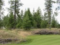 This level lot is situated on the 7th hole of Gozzer Ranch Golf for sale in Harrison Idaho Kootenai County County on GolfHomes.com