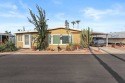 Lovely 2 bed, 2 bath home with an enclosed AZ room adding 250 sq for sale in Apache Junction Arizona Pinal County County on GolfHomes.com