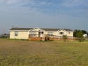 HUGE PRICE REDUCTION!  SPACIOUS 4-bedroom, 3-bath double wide for sale in Dumas Texas Moore County County on GolfHomes.com