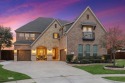 Outstanding luxury home with WATER VIEW in The Tribute!  The for sale in The Colony Texas Denton County County on GolfHomes.com