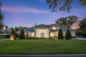 Stunning golf and lake views and beautifully updated grounds are for sale in Windermere Florida Orange County County on GolfHomes.com