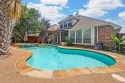 CHARMING 1.5 STORY WITH A TROPICAL BACKYARD OASIS! Fall in love for sale in Lantana Texas Denton County County on GolfHomes.com