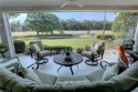 Elegant 1st floor corner condo with large lanai overlooking lake for sale in Naples Florida Collier County County on GolfHomes.com