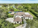 This ONE-OF-A-KIND custom built home on 1.25 acres on a private for sale in Jupiter Florida Martin County County on GolfHomes.com