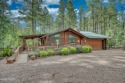 COZY LOG HOME in Pinetop Country Club. Large landscaped lot for sale in Pinetop Arizona Navajo County County on GolfHomes.com