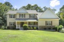 With 4 bedrooms and 2 1/2 baths, this home sits on over half an for sale in Hampstead North Carolina Pender County County on GolfHomes.com