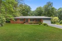 Welcome to a beautifully, partially updated brick home nestled for sale in Sanford North Carolina Lee County County on GolfHomes.com